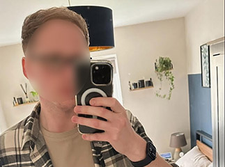 Man taking selfie in mirror.
