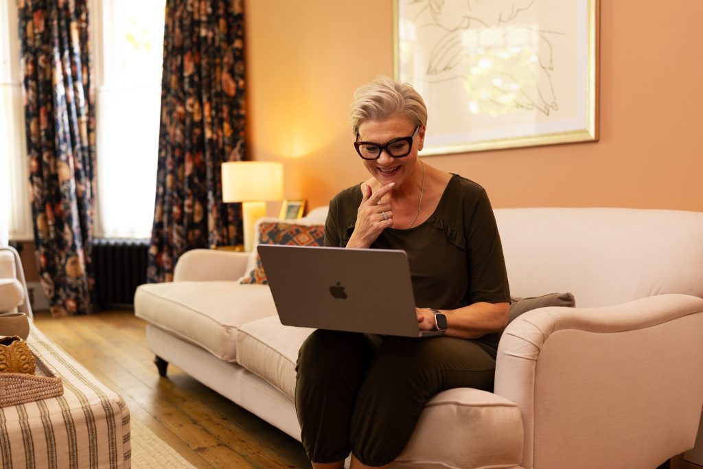Woman on sofa on laptop