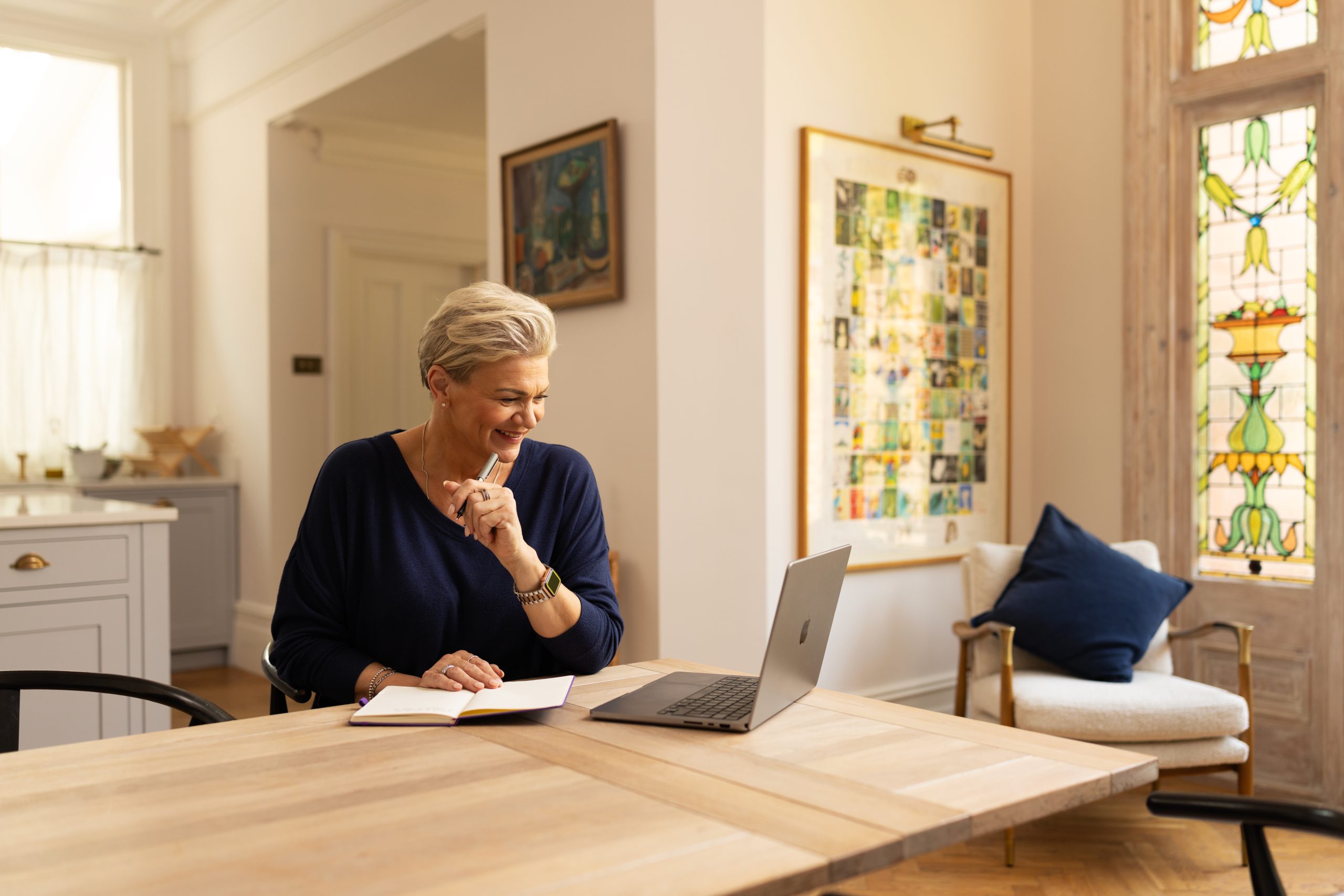 Woman with laptop on table