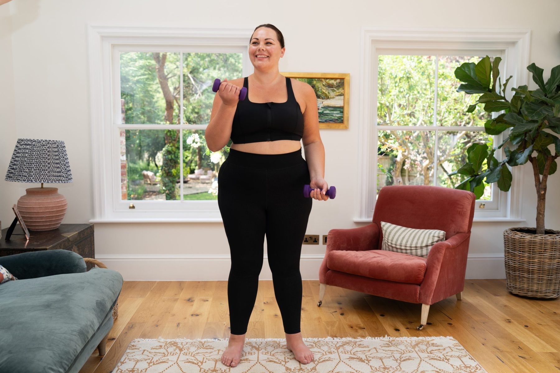 Woman looking happy working out in lounge