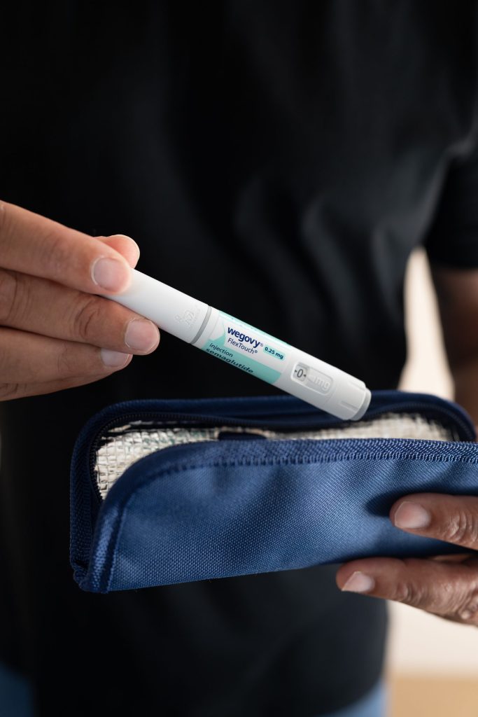 man holding wegovy pen