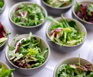 Leafy greens in multiple bowls