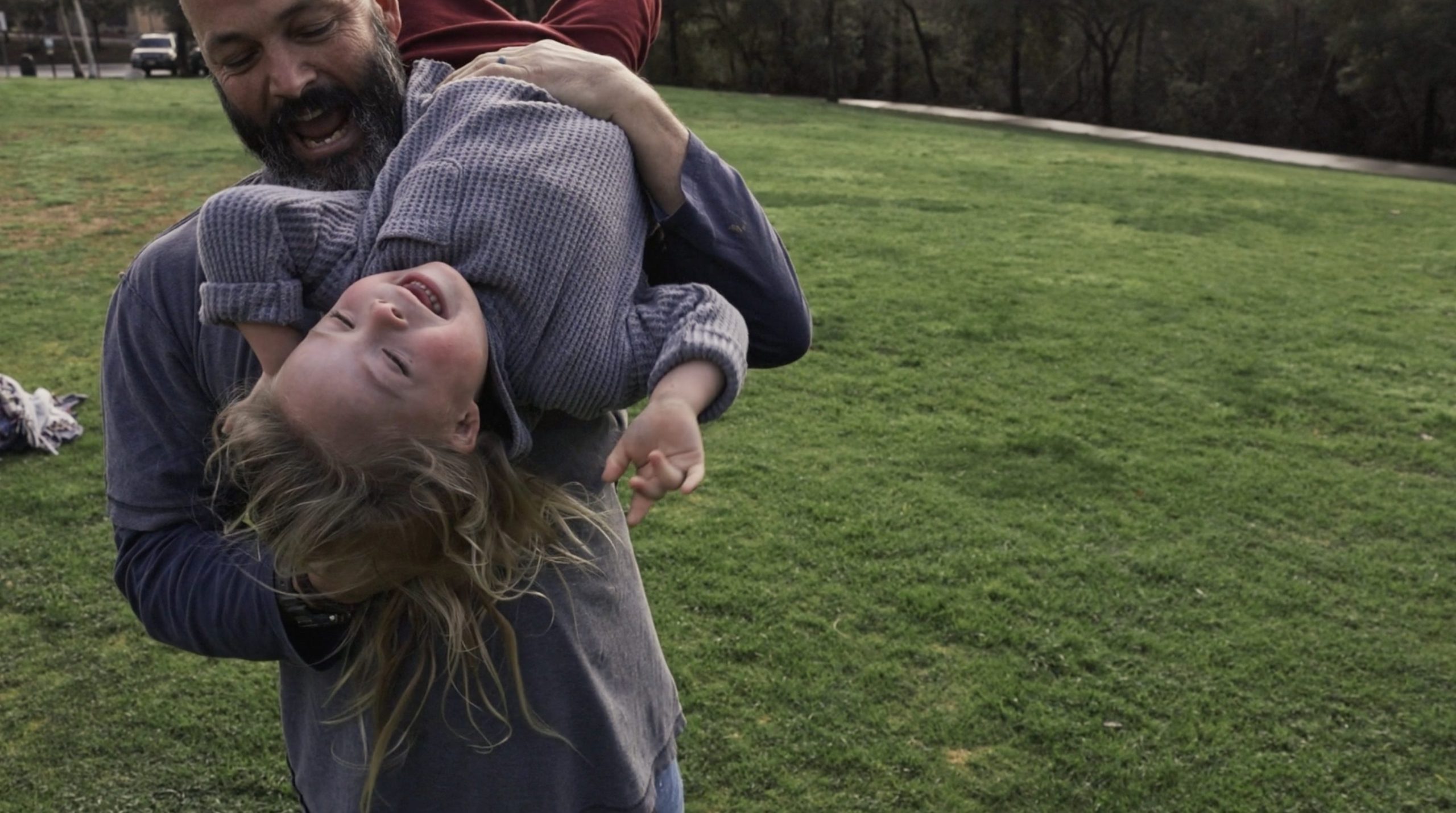 Father playing with his daughter in the park